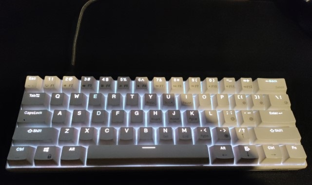 a white keyboard, with backlit keys